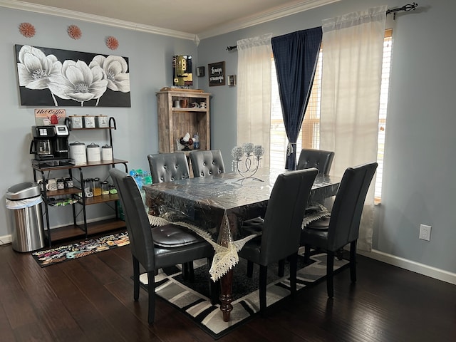 dining space featuring crown molding, baseboards, and hardwood / wood-style flooring