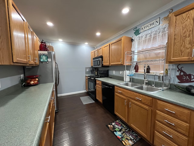 kitchen with dark wood-style floors, recessed lighting, ornamental molding, a sink, and black appliances