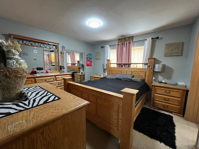 bedroom with carpet flooring and a textured ceiling