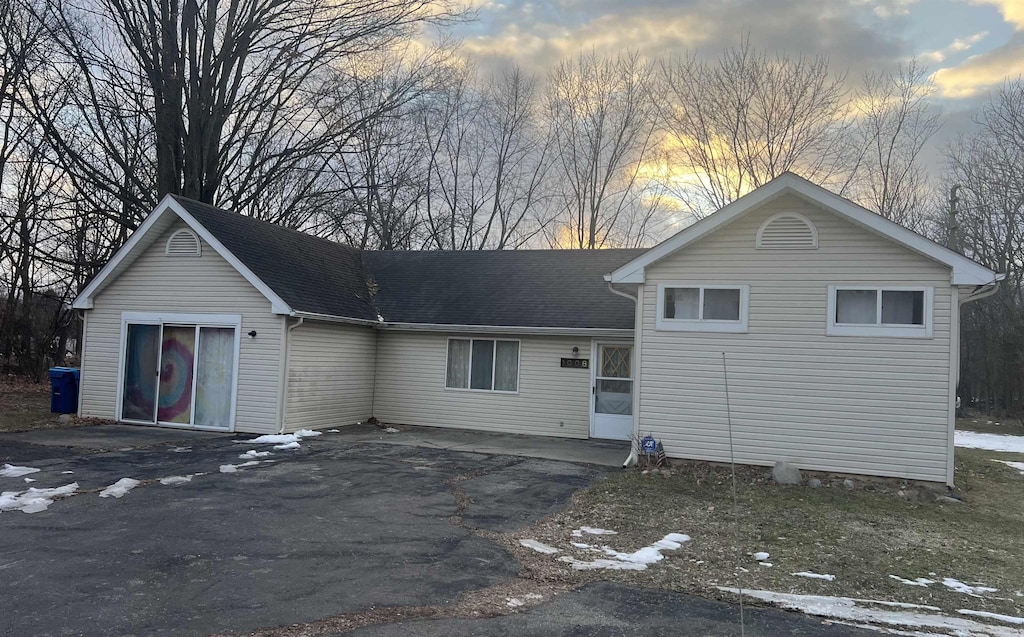 split level home featuring aphalt driveway