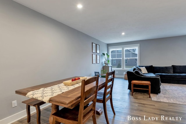 dining area featuring recessed lighting, baseboards, and wood finished floors