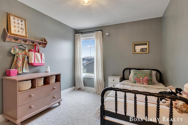 bedroom with carpet and baseboards