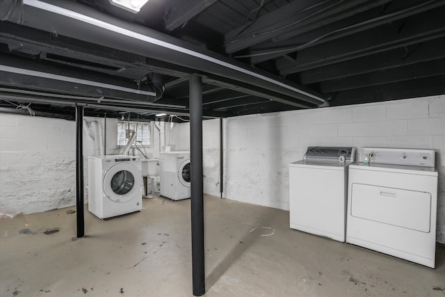 unfinished basement featuring independent washer and dryer