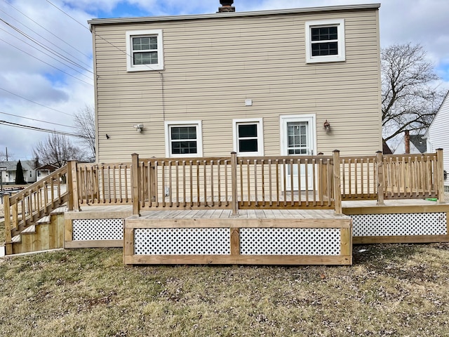 back of house featuring a wooden deck