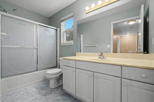 full bathroom with toilet, marble finish floor, enclosed tub / shower combo, and vanity