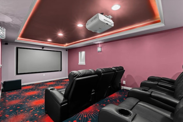 carpeted home theater room with baseboards, a raised ceiling, and recessed lighting