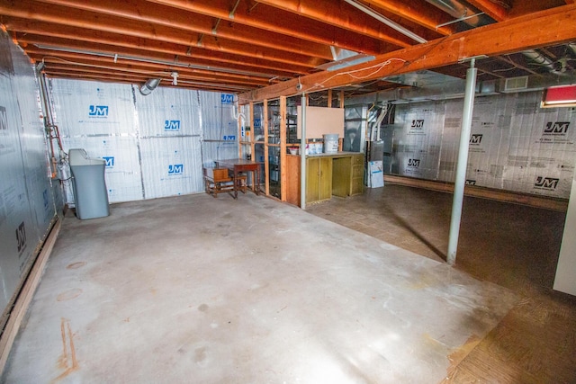 unfinished basement with water heater