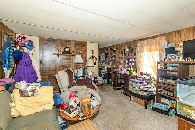 interior space featuring carpet and wooden walls