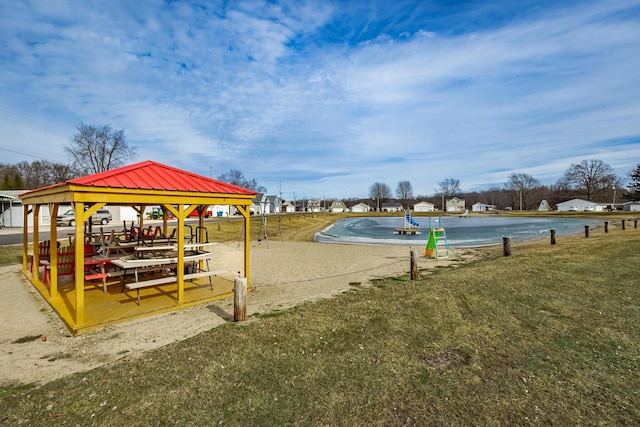 view of community featuring a lawn and a gazebo