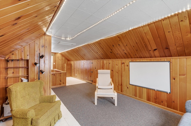 unfurnished room featuring carpet, wood ceiling, vaulted ceiling, and wooden walls