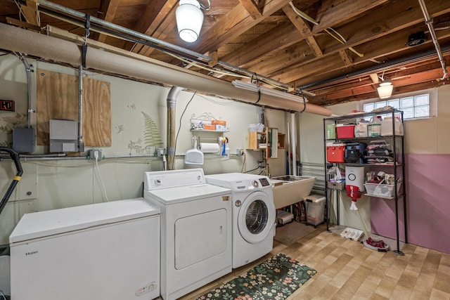 clothes washing area featuring laundry area and washer and dryer