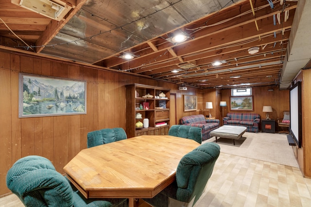 dining room featuring wooden walls