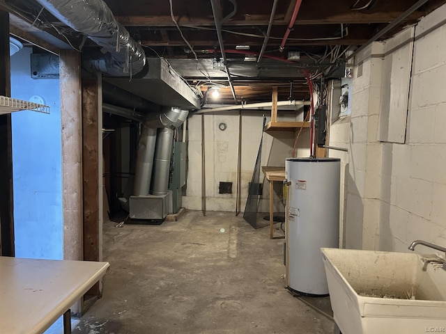 unfinished below grade area with gas water heater and a sink