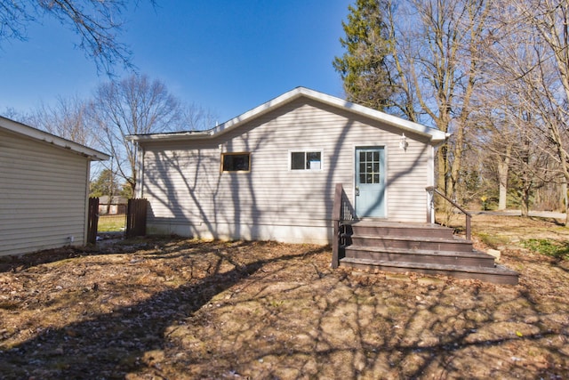 back of house with fence