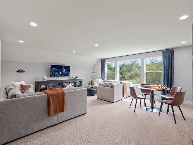 living room featuring vaulted ceiling, recessed lighting, and light colored carpet