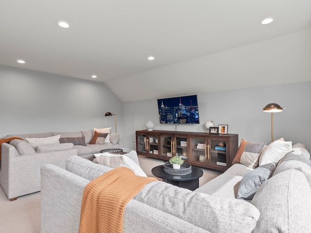 carpeted living area with lofted ceiling and recessed lighting