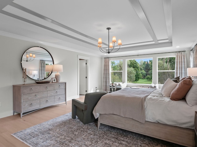 bedroom with crown molding, a raised ceiling, an inviting chandelier, wood finished floors, and baseboards