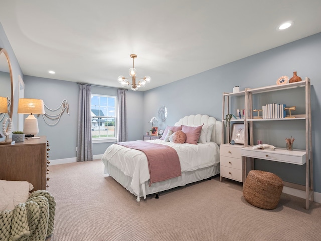 carpeted bedroom with recessed lighting, a notable chandelier, and baseboards