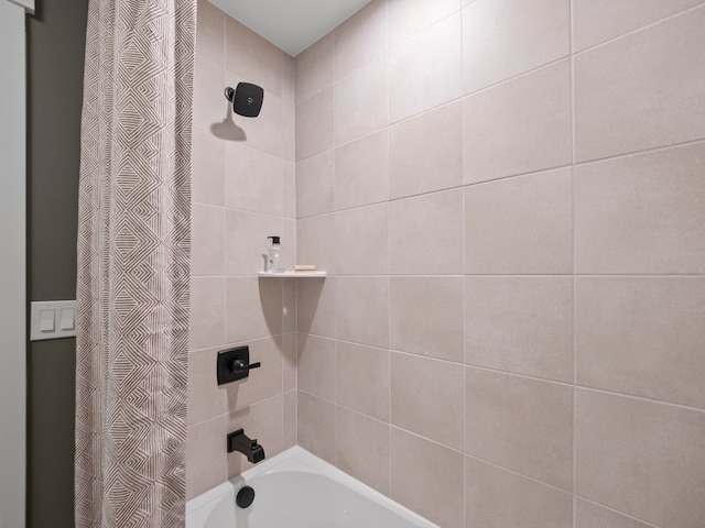 bathroom with shower / bath combo with shower curtain