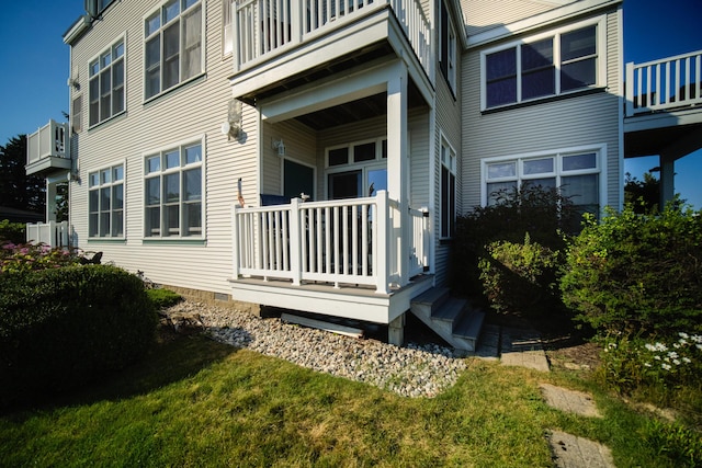 rear view of house featuring a balcony