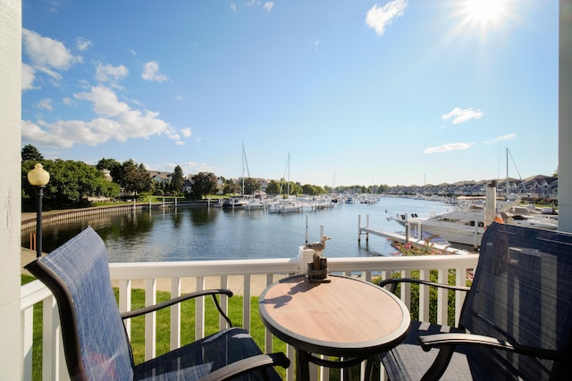 exterior space with a dock and a water view