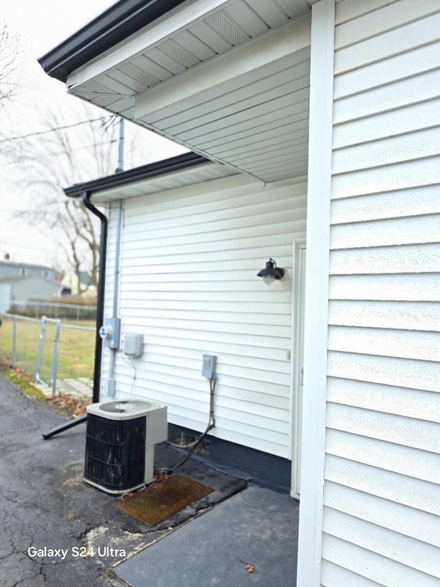 view of side of home featuring central AC unit