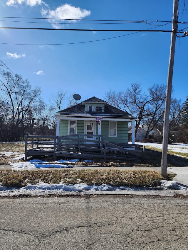 bungalow-style home with a fenced front yard