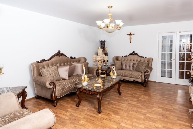 living area featuring a chandelier, french doors, and light wood finished floors