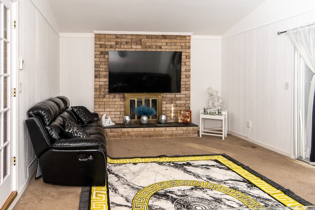 living room featuring lofted ceiling, a brick fireplace, carpet, and ornamental molding