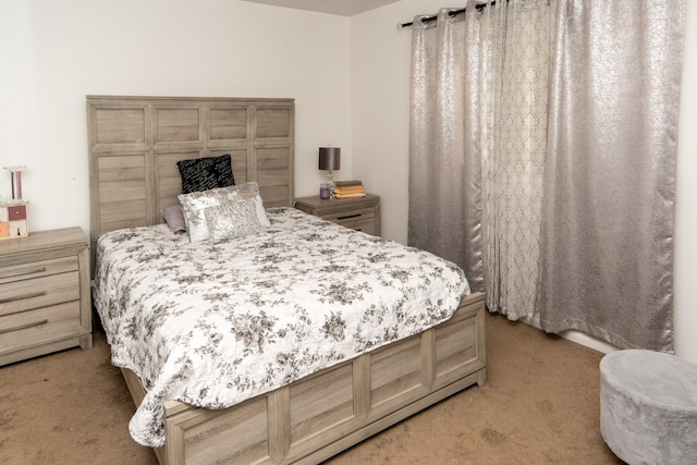 bedroom with light colored carpet