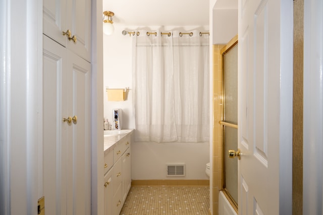 bathroom with a shower with shower door, tile patterned flooring, visible vents, and vanity