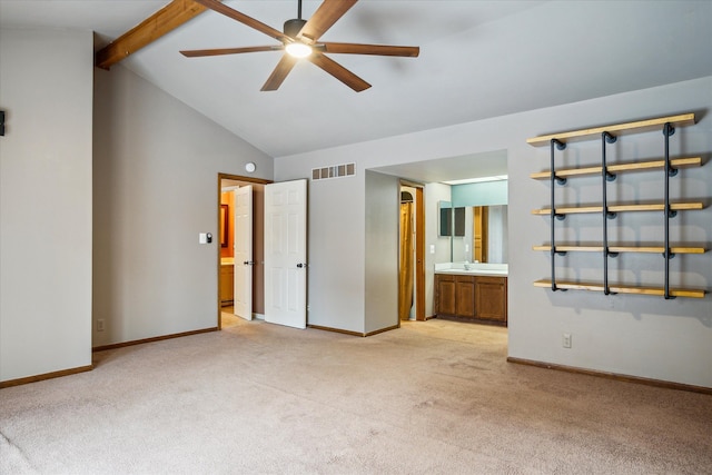 empty room featuring light carpet, baseboards, visible vents, and beamed ceiling