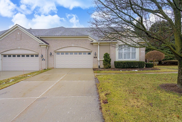 view of front facade with a garage, a front lawn, concrete driveway, and brick siding