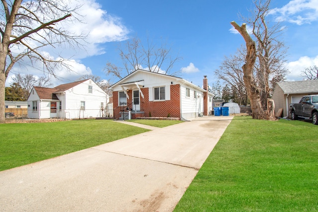bungalow-style house featuring brick siding, concrete driveway, a front yard, and fence
