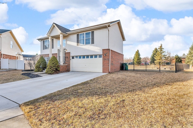 view of front of house with brick siding, a gate, fence, a garage, and driveway