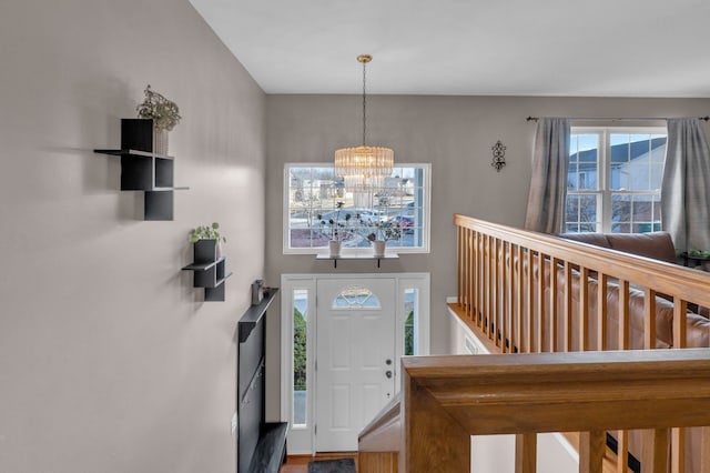 foyer with a notable chandelier