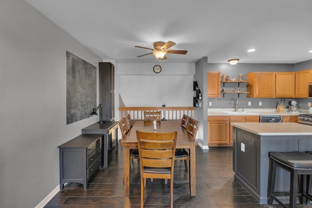 kitchen featuring dark wood-type flooring, baseboards, open shelves, and a sink