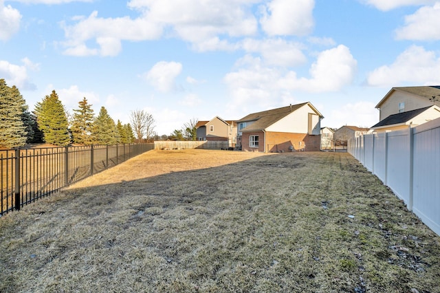 view of yard with a fenced backyard