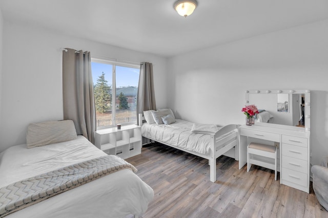 bedroom featuring wood finished floors