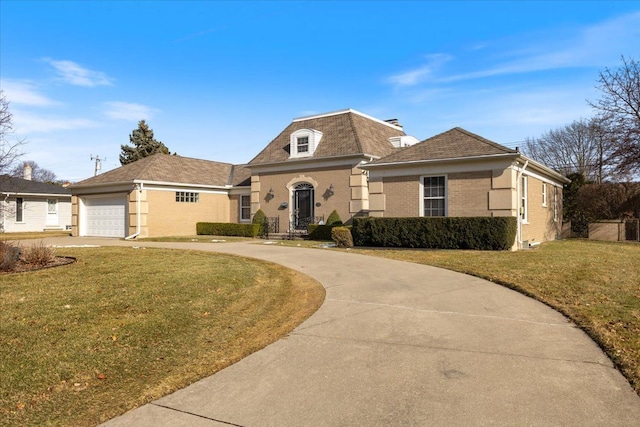 french provincial home with concrete driveway, a front lawn, and brick siding