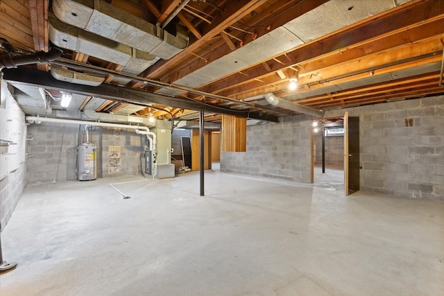 unfinished basement featuring heating unit and gas water heater