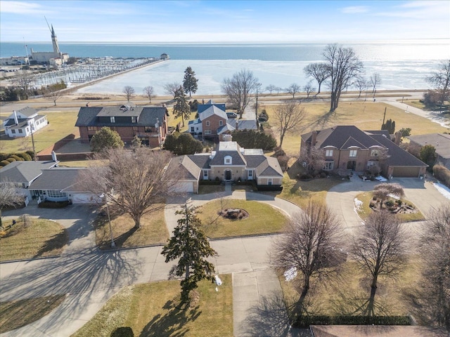 bird's eye view featuring a residential view and a water view