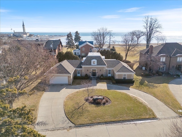 birds eye view of property with a water view