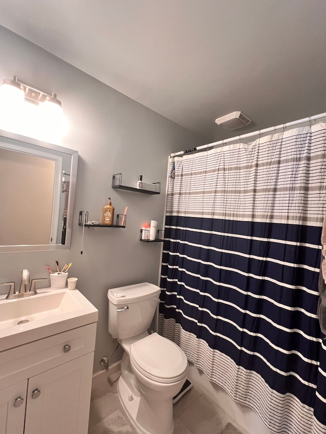 bathroom featuring visible vents, toilet, tile patterned floors, curtained shower, and vanity