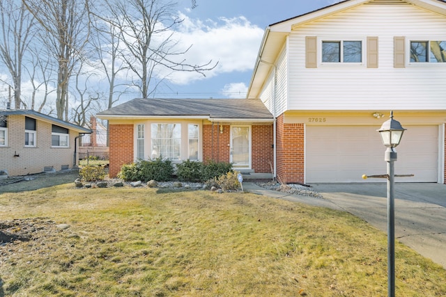 view of front of house with a garage, brick siding, concrete driveway, and a front lawn