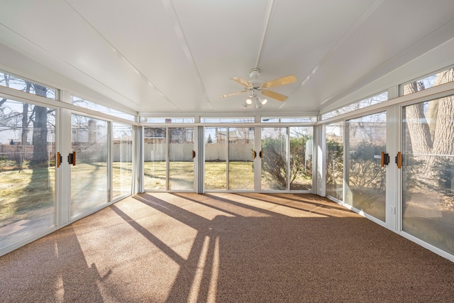 unfurnished sunroom with a wealth of natural light and a ceiling fan