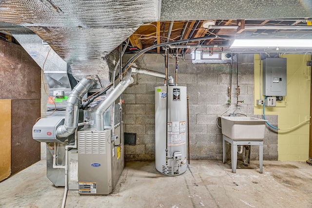 unfinished below grade area featuring water heater, a sink, and electric panel