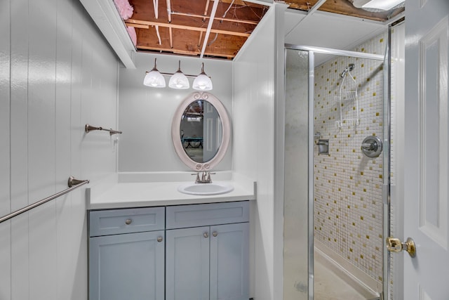 bathroom featuring a stall shower and vanity