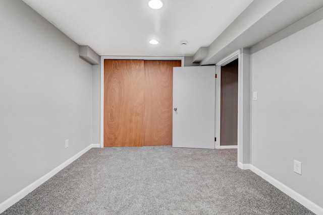 interior space featuring recessed lighting, carpet, and baseboards