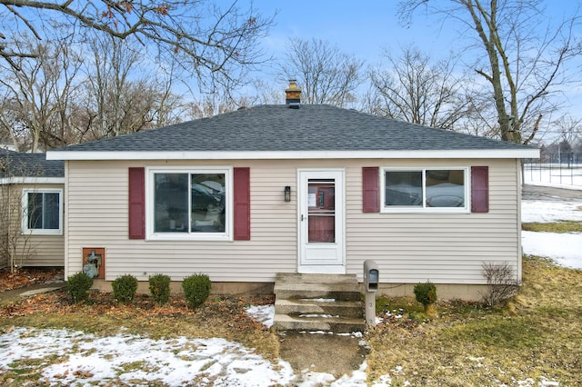 view of front facade with a shingled roof